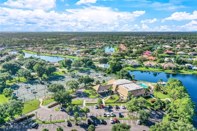 birds eye view of property featuring a water view and a residential view