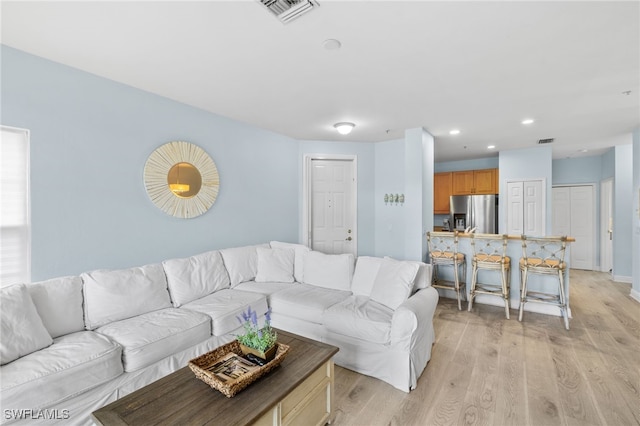 1305 Sweetwater Cv Unit 104, Naples, FL 34110 - living area with visible vents, light wood-style flooring, and recessed lighting