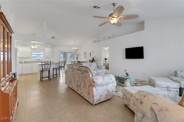 living room featuring light tile patterned floors, visible vents, ceiling fan with notable chandelier, and high vaulted ceiling