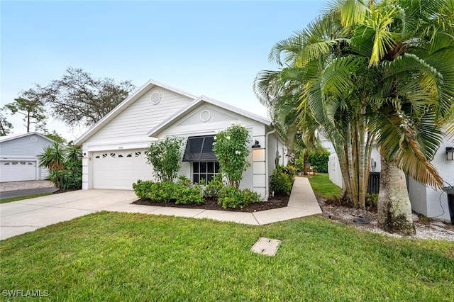 ranch-style home featuring stucco siding, a front yard, concrete driveway, and an attached garage