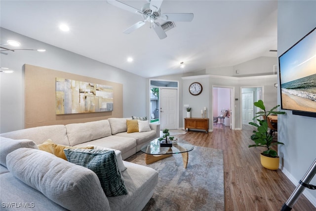 living room with ceiling fan, wood finished floors, visible vents, baseboards, and lofted ceiling