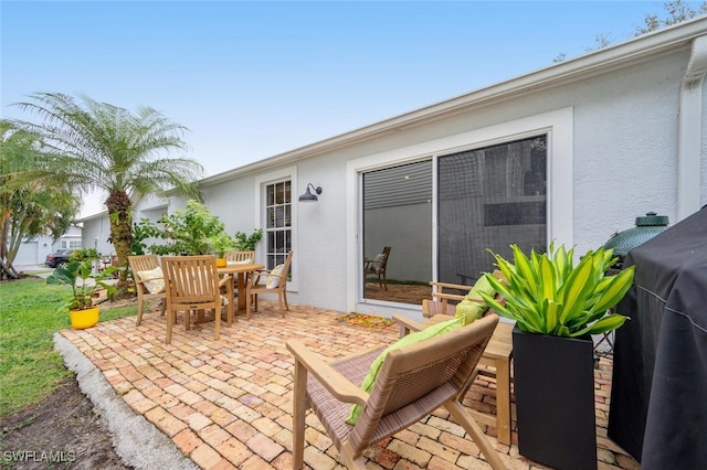 view of patio / terrace featuring a grill and outdoor dining area