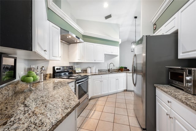 kitchen with a sink, stainless steel appliances, light tile patterned flooring, wall chimney exhaust hood, and white cabinets