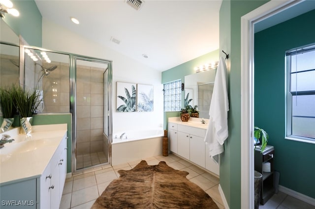 full bathroom with lofted ceiling, two vanities, visible vents, and a shower stall