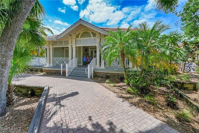 3129 Preserves Edge Ct, Fort Myers, FL 33905 - coastal inspired home with a porch