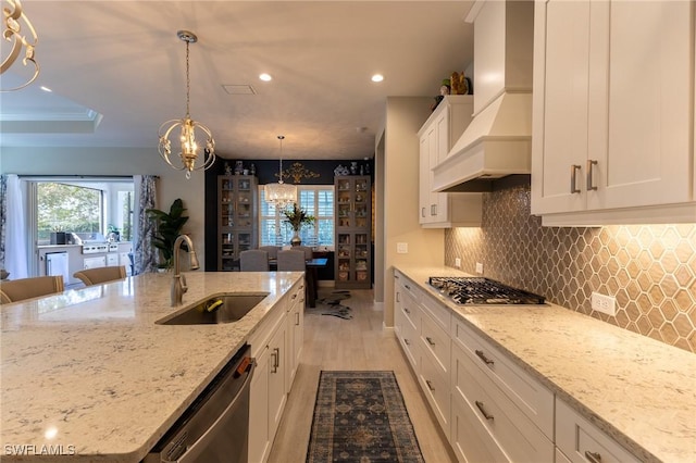 3129 Preserves Edge Ct, Fort Myers, FL 33905 - kitchen featuring recessed lighting, custom exhaust hood, a chandelier, appliances with stainless steel finishes, and a sink