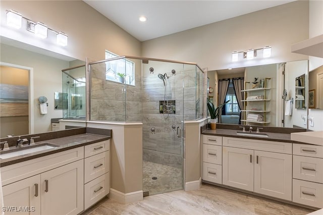 3129 Preserves Edge Ct, Fort Myers, FL 33905 - bathroom featuring two vanities, a shower stall, marble finish floor, and a sink