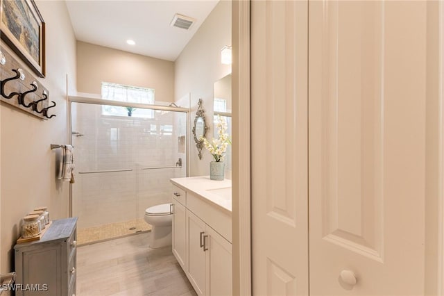 3129 Preserves Edge Ct, Fort Myers, FL 33905 - full bath with a shower stall, visible vents, toilet, wood finished floors, and vanity