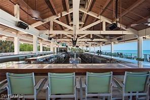 7048 Pelican Bay Blvd Unit C104, Naples, FL 34108 - exterior space featuring vaulted ceiling