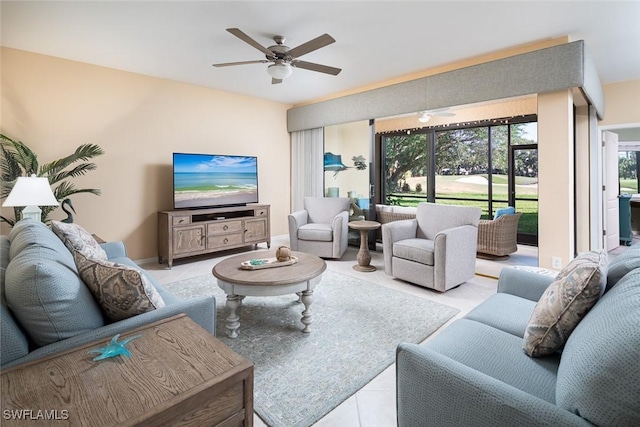 7048 Pelican Bay Blvd Unit C104, Naples, FL 34108 - living room with tile patterned floors and a ceiling fan