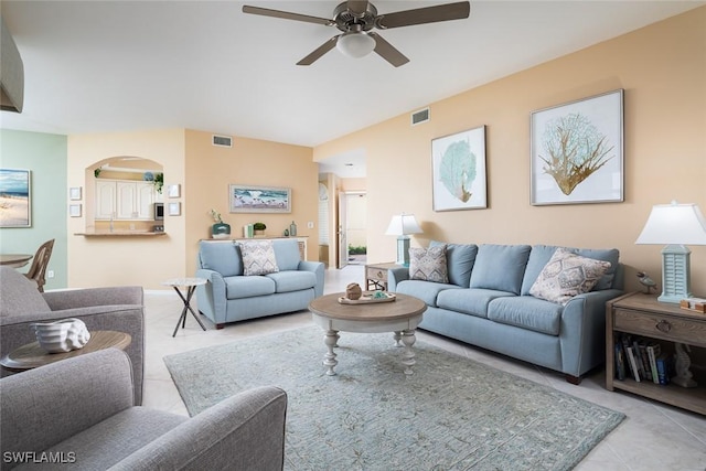 7048 Pelican Bay Blvd Unit C104, Naples, FL 34108 - living area with arched walkways, tile patterned flooring, a ceiling fan, and visible vents