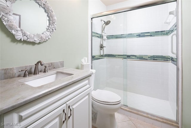 7048 Pelican Bay Blvd Unit C104, Naples, FL 34108 - full bath featuring vanity, tile patterned floors, a shower stall, and toilet