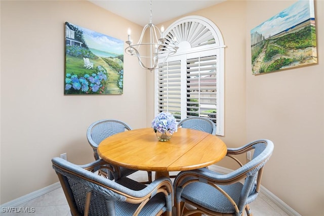 7048 Pelican Bay Blvd Unit C104, Naples, FL 34108 - dining space with an inviting chandelier, baseboards, and light tile patterned flooring