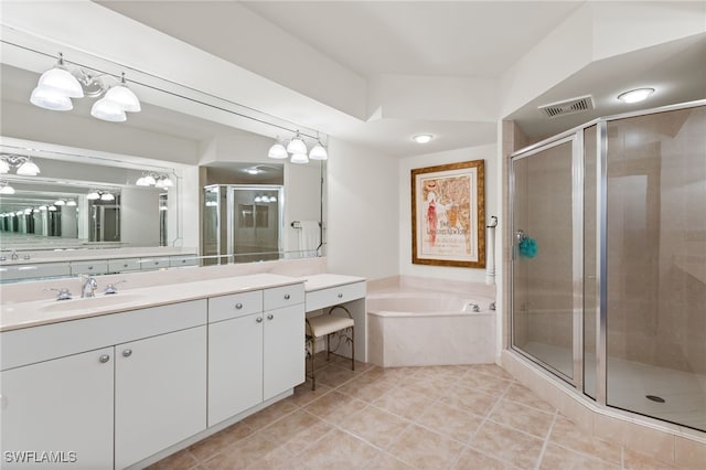 14250 Royal Harbour Ct Unit 913, Fort Myers, FL 33908 - bathroom with vanity, a shower stall, tile patterned flooring, and a garden tub