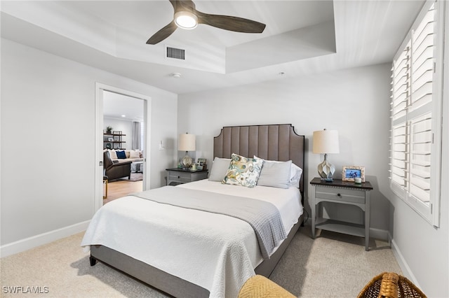 14250 Royal Harbour Ct Unit 913, Fort Myers, FL 33908 - bedroom featuring a raised ceiling, light carpet, and baseboards