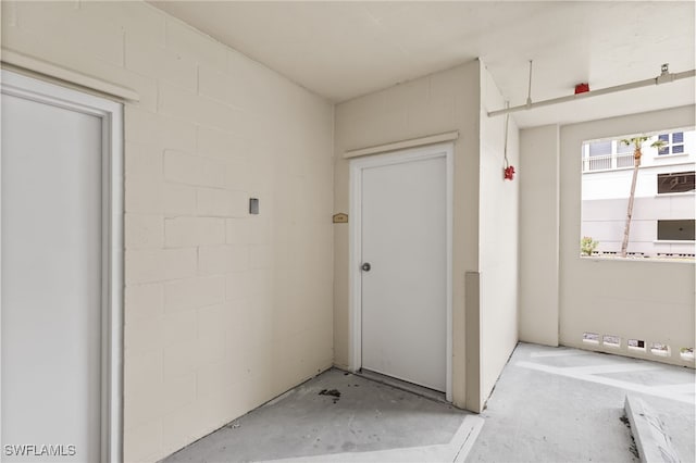 14250 Royal Harbour Ct Unit 913, Fort Myers, FL 33908 - doorway to property with concrete block siding