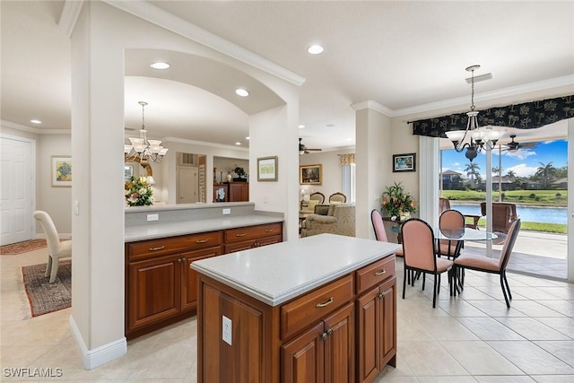 28666 San Lucas Ln Unit 102, Bonita Springs, FL 34135 - kitchen with light tile patterned floors, light countertops, and a notable chandelier