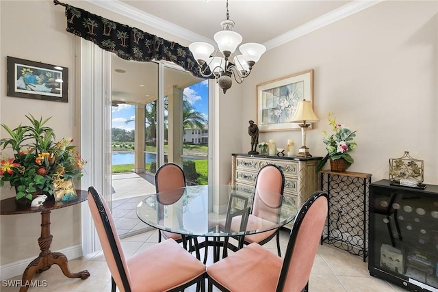 28666 San Lucas Ln Unit 102, Bonita Springs, FL 34135 - dining room with crown molding, baseboards, light tile patterned flooring, and an inviting chandelier