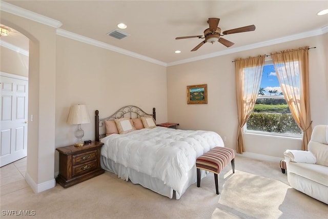 28666 San Lucas Ln Unit 102, Bonita Springs, FL 34135 - bedroom with crown molding, light colored carpet, arched walkways, baseboards, and visible vents