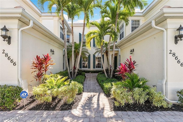 28666 San Lucas Ln Unit 102, Bonita Springs, FL 34135 - doorway to property with stucco siding