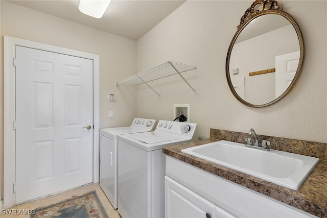 28666 San Lucas Ln Unit 102, Bonita Springs, FL 34135 - laundry area featuring washer and dryer, a sink, and cabinet space