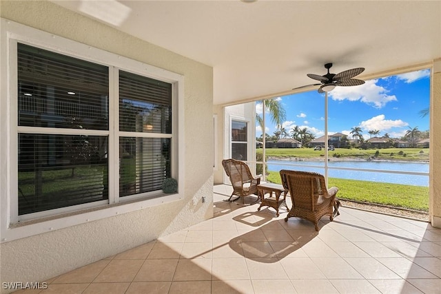 28666 San Lucas Ln Unit 102, Bonita Springs, FL 34135 - view of patio / terrace with a water view and a ceiling fan