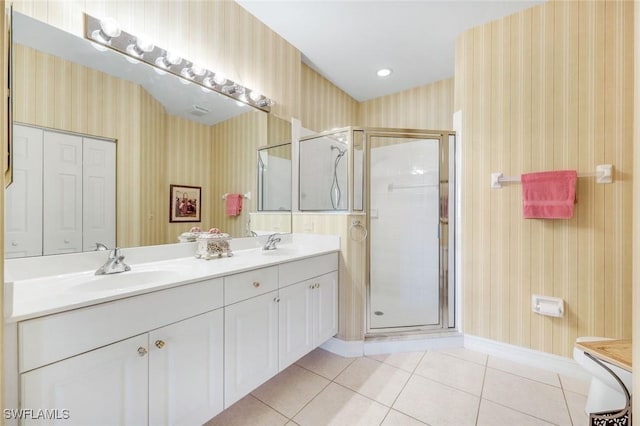 4651 Turnberry Lake Dr Unit 201, Estero, FL 33928 - bathroom featuring a sink, tile patterned floors, a shower stall, and wallpapered walls