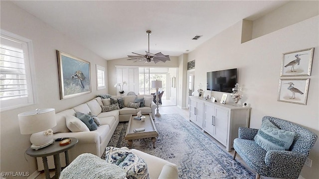 6805 Satinleaf Rd S Unit 201, Naples, FL 34109 - living area featuring lofted ceiling, ceiling fan, visible vents, and baseboards