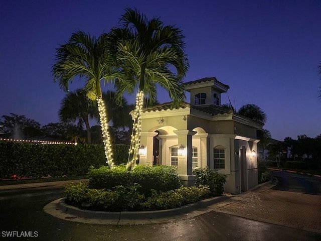 6805 Satinleaf Rd S Unit 201, Naples, FL 34109 - view of front of house featuring stucco siding and a tiled roof