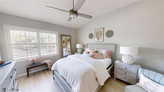 6805 Satinleaf Rd S Unit 201, Naples, FL 34109 - bedroom with light wood-type flooring, ceiling fan, and vaulted ceiling
