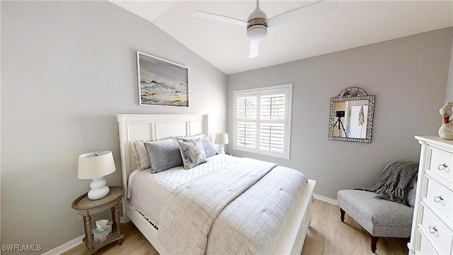 6805 Satinleaf Rd S Unit 201, Naples, FL 34109 - bedroom featuring baseboards, a ceiling fan, lofted ceiling, and light wood finished floors