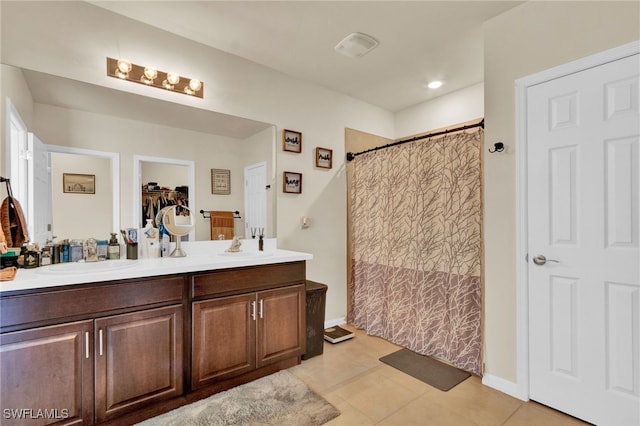 226 NW 4th Ter, Cape Coral, FL 33993 - bathroom with tile patterned floors, curtained shower, double vanity, and a sink