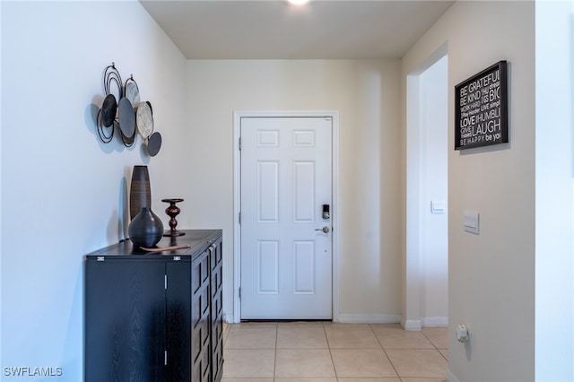 226 NW 4th Ter, Cape Coral, FL 33993 - entrance foyer with light tile patterned floors and baseboards