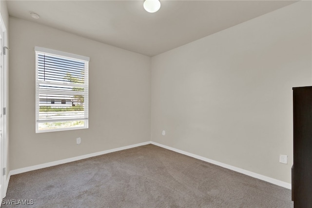 226 NW 4th Ter, Cape Coral, FL 33993 - spare room with baseboards and carpet floors