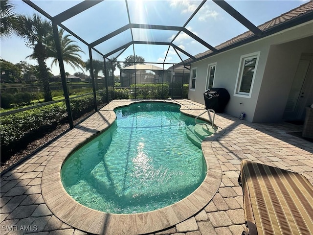 pool featuring a lanai and a patio