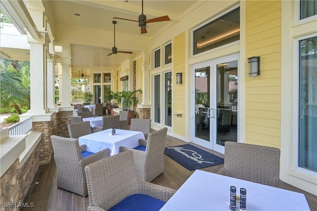 view of patio featuring outdoor dining area, ceiling fan, and french doors