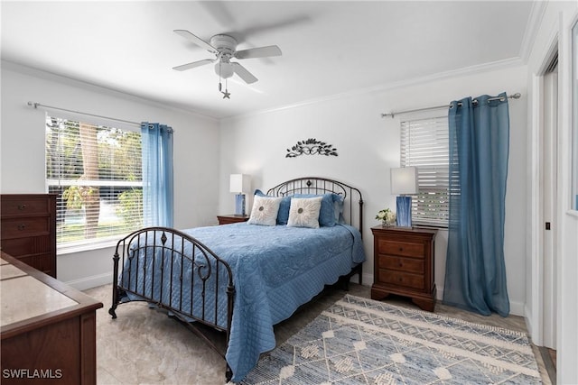 bedroom with ornamental molding, ceiling fan, and baseboards
