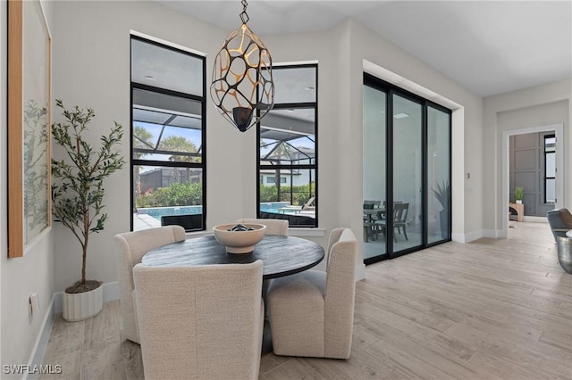 16198 Verilyn Cir, Naples, FL 34110 - dining area featuring wood finished floors and baseboards
