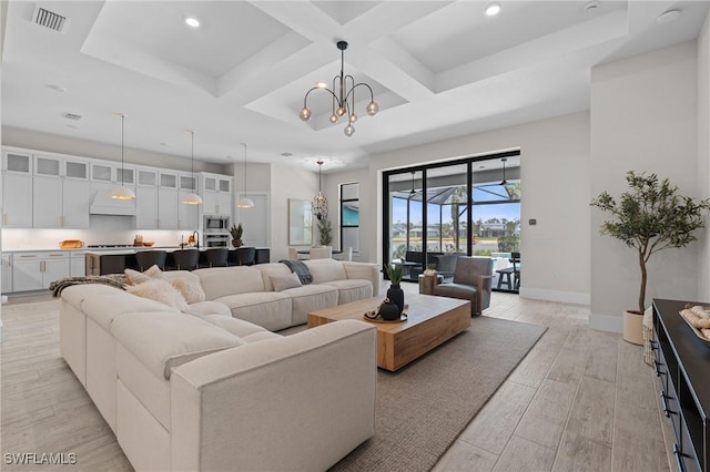16198 Verilyn Cir, Naples, FL 34110 - living area featuring coffered ceiling, recessed lighting, light wood-style flooring, baseboards, and a chandelier