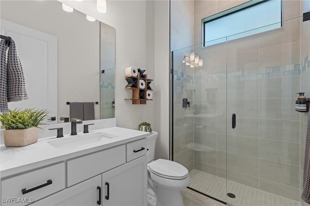 16198 Verilyn Cir, Naples, FL 34110 - full bathroom with vanity, a stall shower, and toilet
