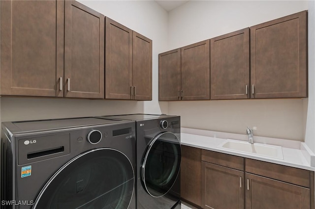 16198 Verilyn Cir, Naples, FL 34110 - laundry area featuring independent washer and dryer and cabinet space
