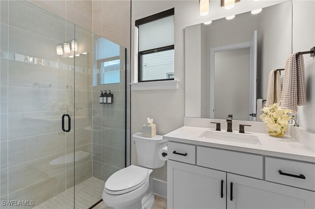 16198 Verilyn Cir, Naples, FL 34110 - full bathroom with toilet, vanity, a shower stall, and baseboards