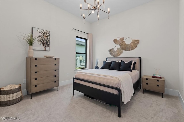 16198 Verilyn Cir, Naples, FL 34110 - carpeted bedroom featuring a chandelier and baseboards