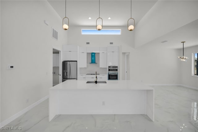 kitchen with marble finish floor, visible vents, stainless steel appliances, and modern cabinets