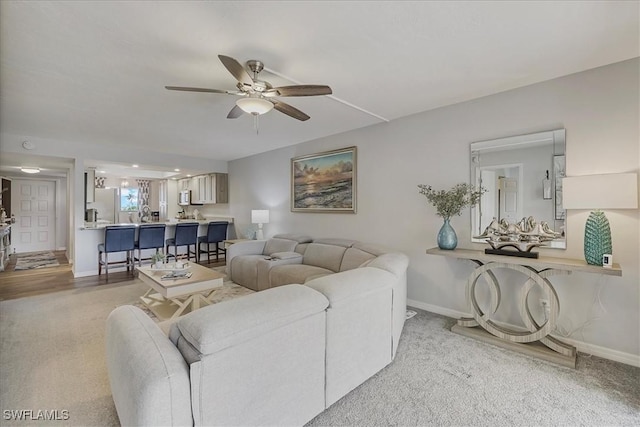 4719 SE 17th Pl Unit 208, Cape Coral, FL 33904 - carpeted living area featuring baseboards and a ceiling fan