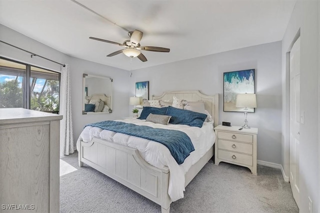 4719 SE 17th Pl Unit 208, Cape Coral, FL 33904 - bedroom featuring baseboards, ceiling fan, and carpet flooring