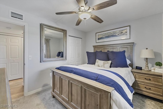 4719 SE 17th Pl Unit 208, Cape Coral, FL 33904 - bedroom with visible vents, a closet, baseboards, light colored carpet, and a ceiling fan