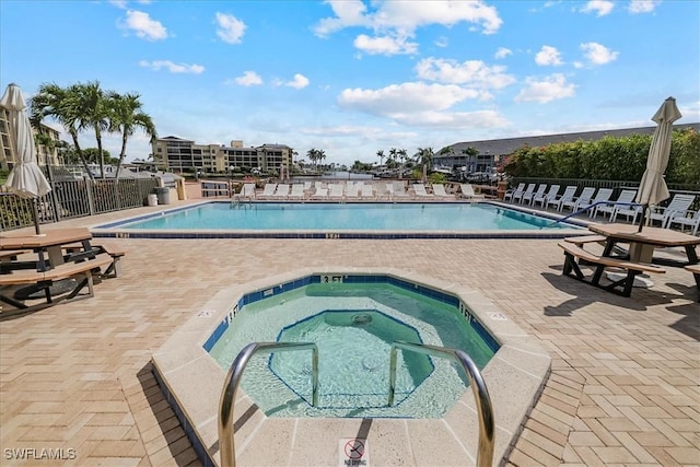 4719 SE 17th Pl Unit 208, Cape Coral, FL 33904 - community pool with fence, a hot tub, and a patio area