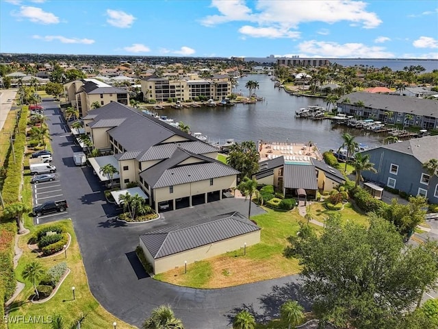 4719 SE 17th Pl Unit 208, Cape Coral, FL 33904 - drone / aerial view featuring a water view and a residential view