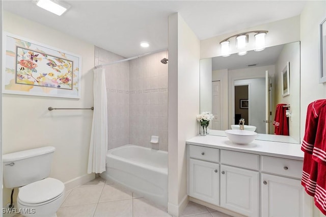 full bath featuring baseboards, shower / tub combo with curtain, tile patterned flooring, and vanity
